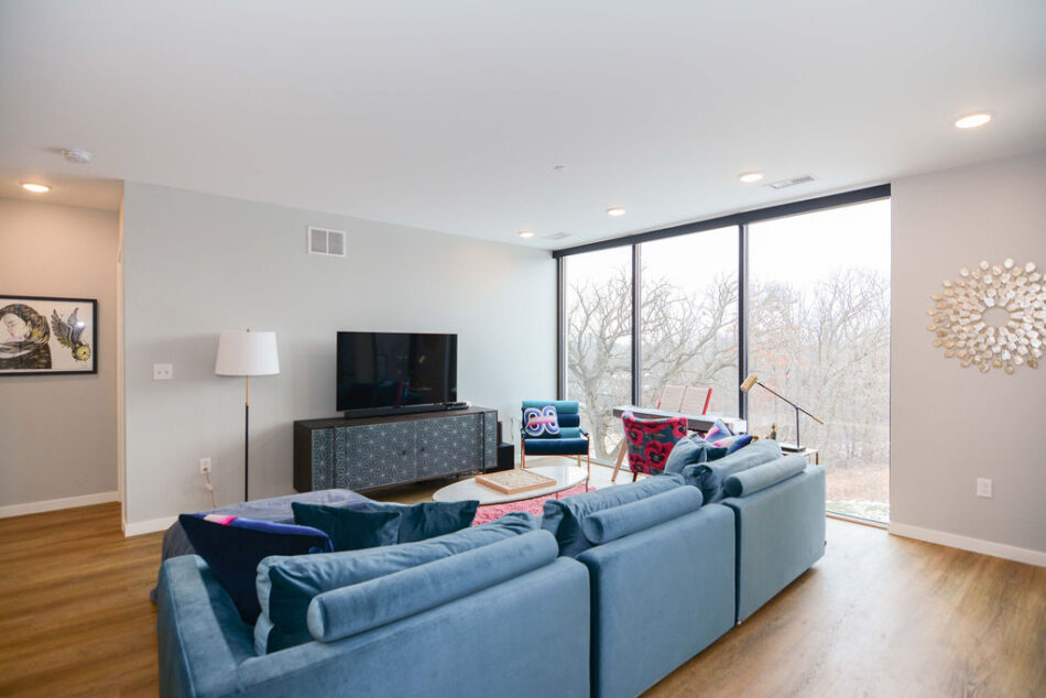 Living room with gray walls and white trim.