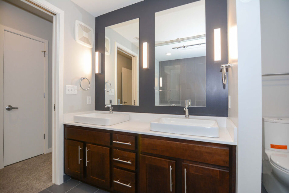 Bathroom with double sinks and double mirrors.