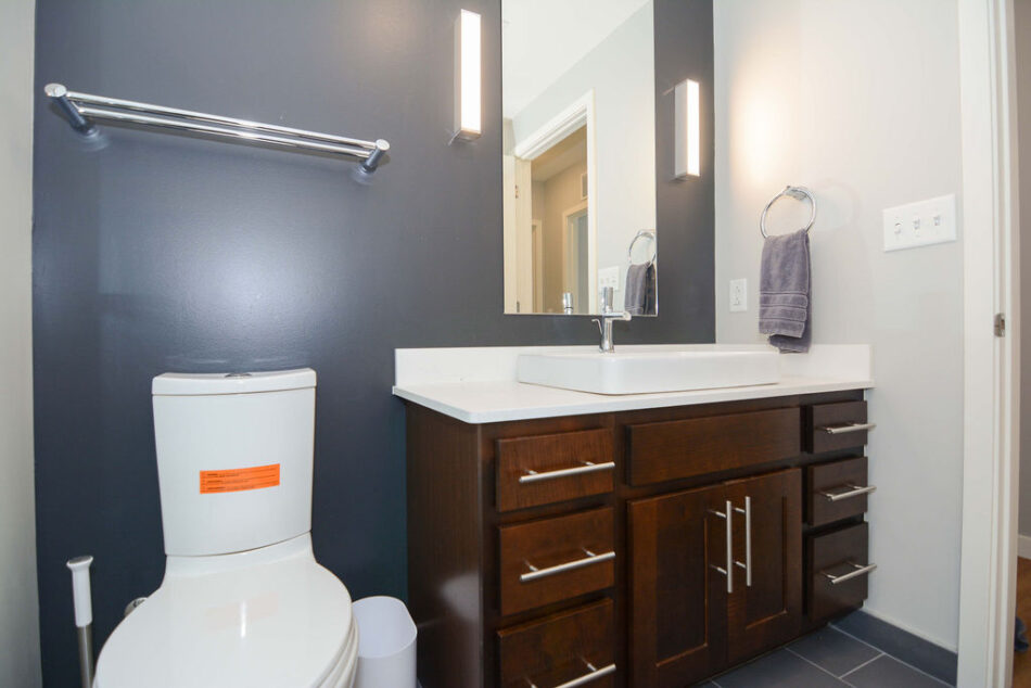 Bathroom with towel rack and vanity.