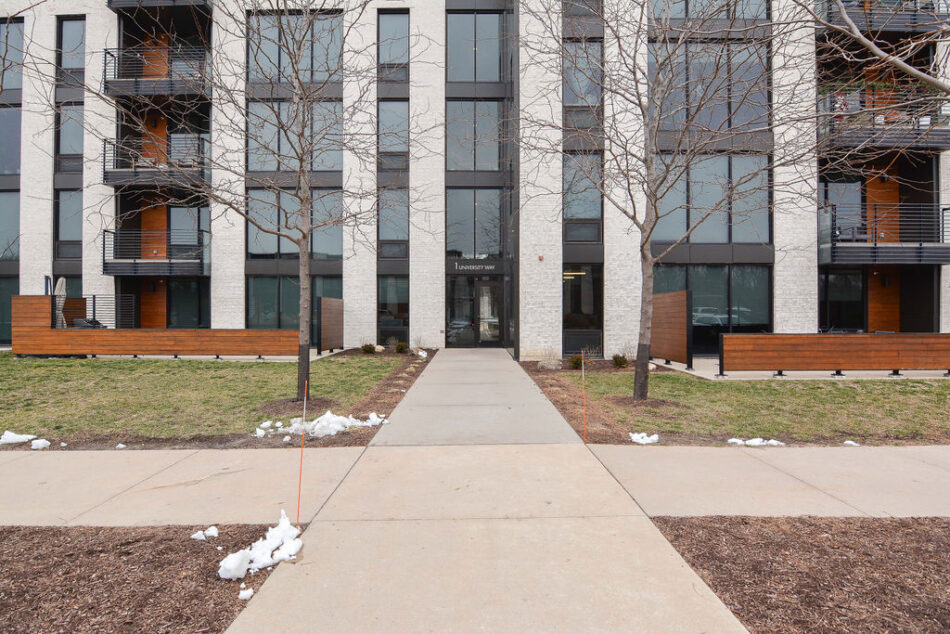 Glass and concrete condo building.