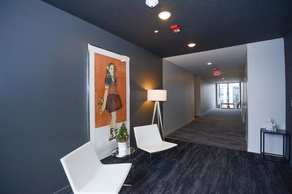 Sitting area in hallway outside condo.