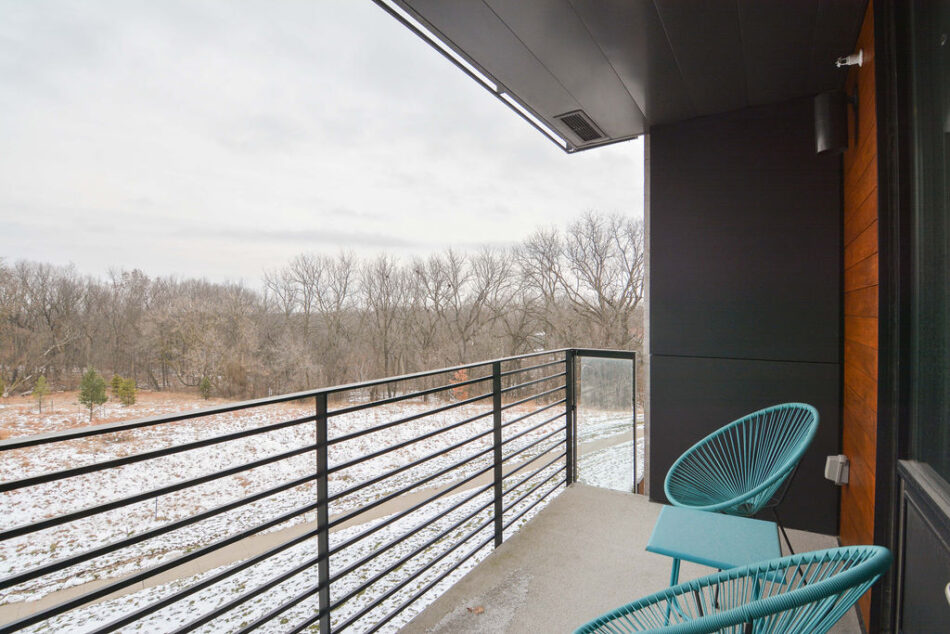 Balcony with wooded view.