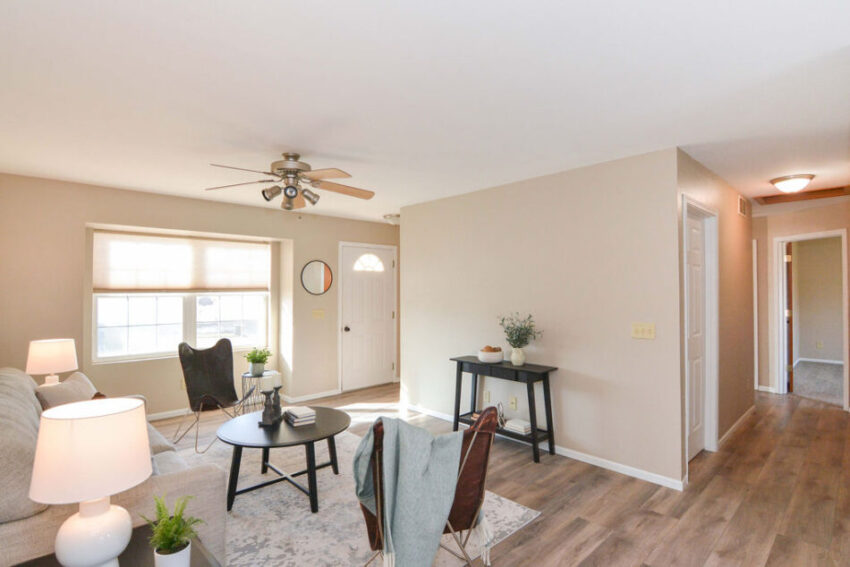 Living room with hallway entrance ot one side.