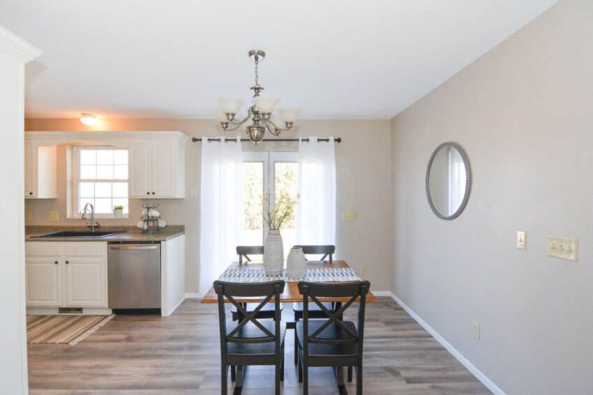 Dining area with double-doors leading outside.