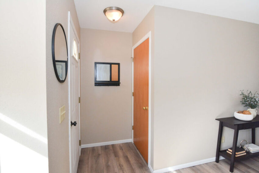 Entryway with coat closet and LVP floor.