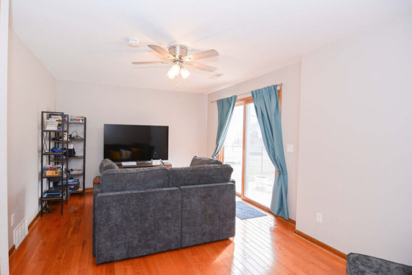 Entertainment room with double glass doors.