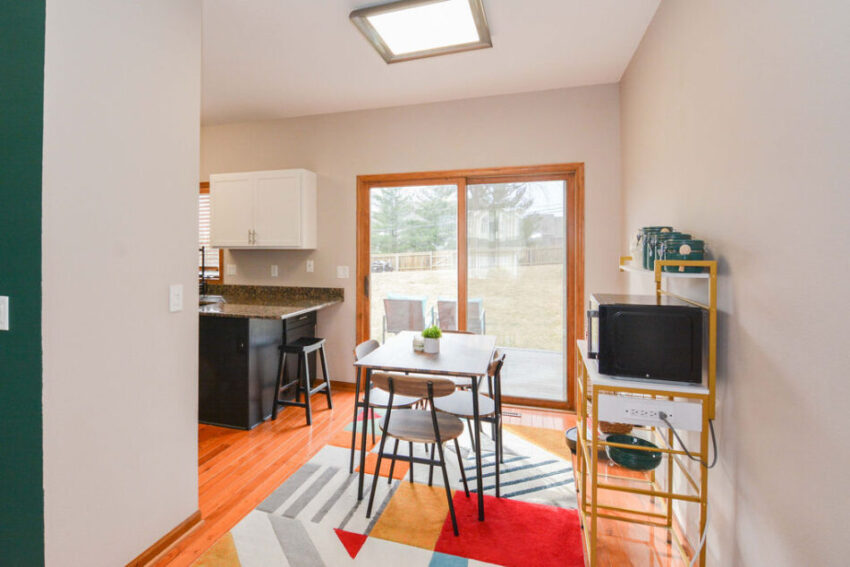 Dining room with kitchen beyond.