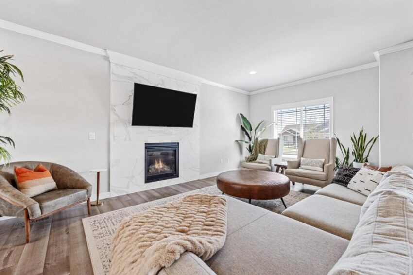 Living room with floor-to-ceiling tiled hearth for electric fireplace.