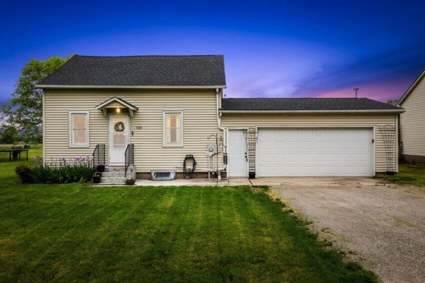 Adorable small house with glowing windows.