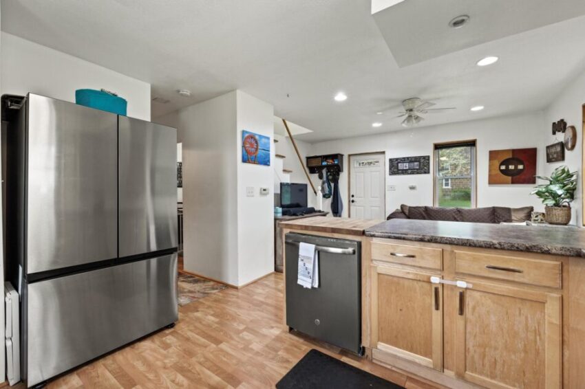 Kitchen with fridge and washer.