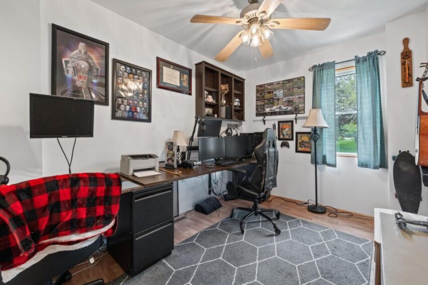 Office with desk chair and white walls.