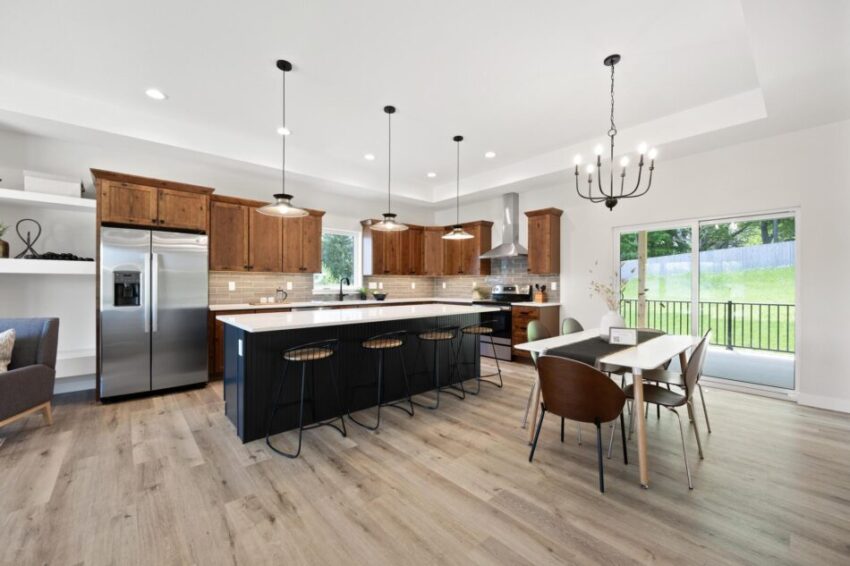 Generous kitchen with stainless steel appliances.