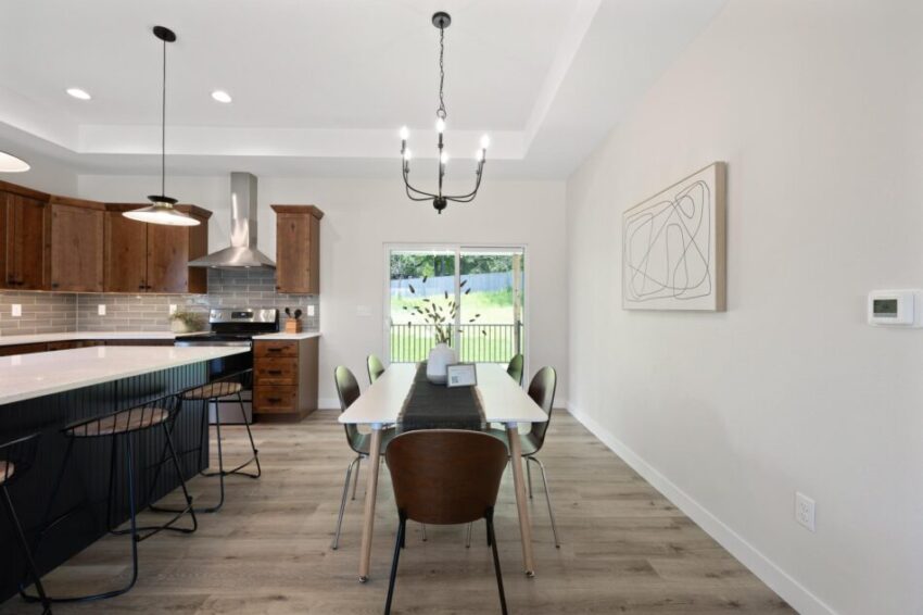 Dining room table and seating at kitchen island.