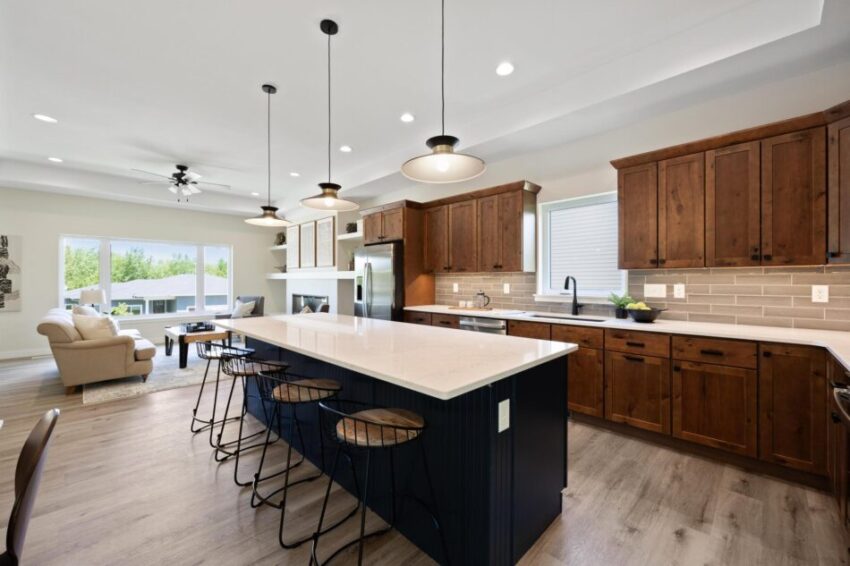 Island with seating and pendant lights.