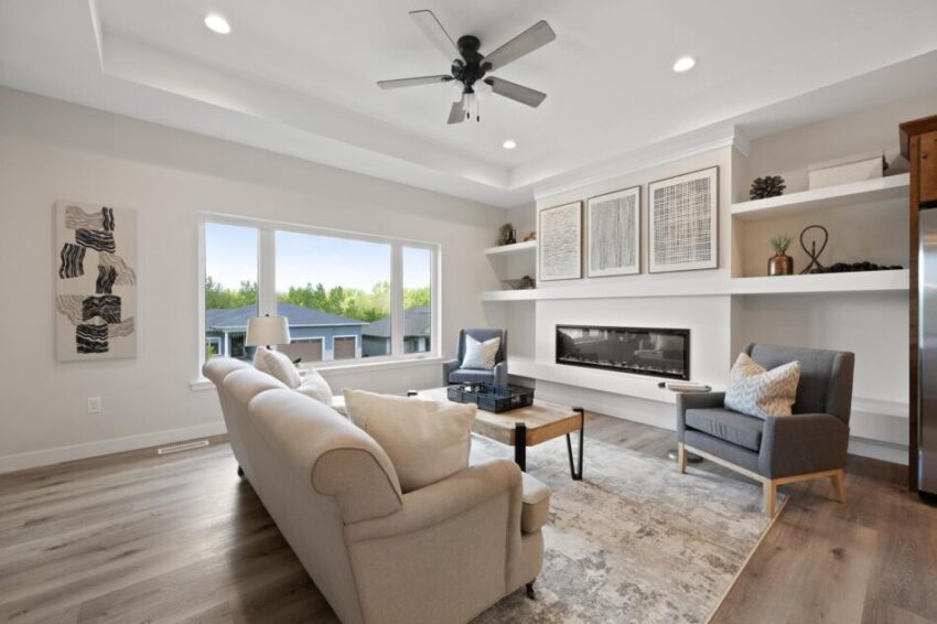 Living rooms with 10' ceilings and electric fireplace.
