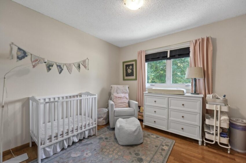 Bedroom with crib and bunting.