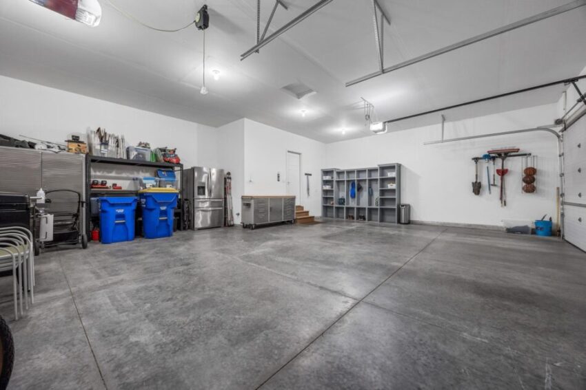 Garage with storage and white walls.