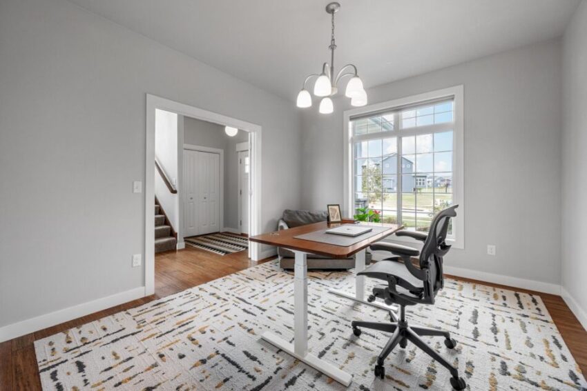 Office with overhead light fixture and lovely view.
