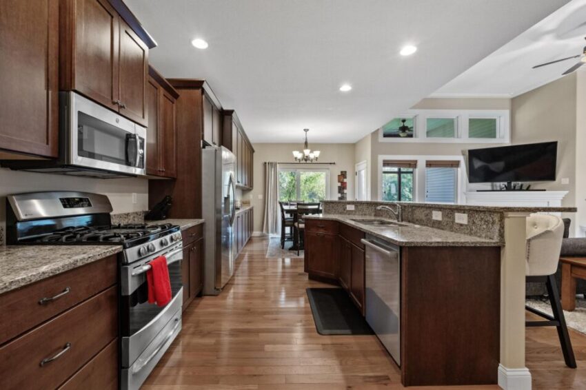 Kitchen with counter seating and granite countertops.