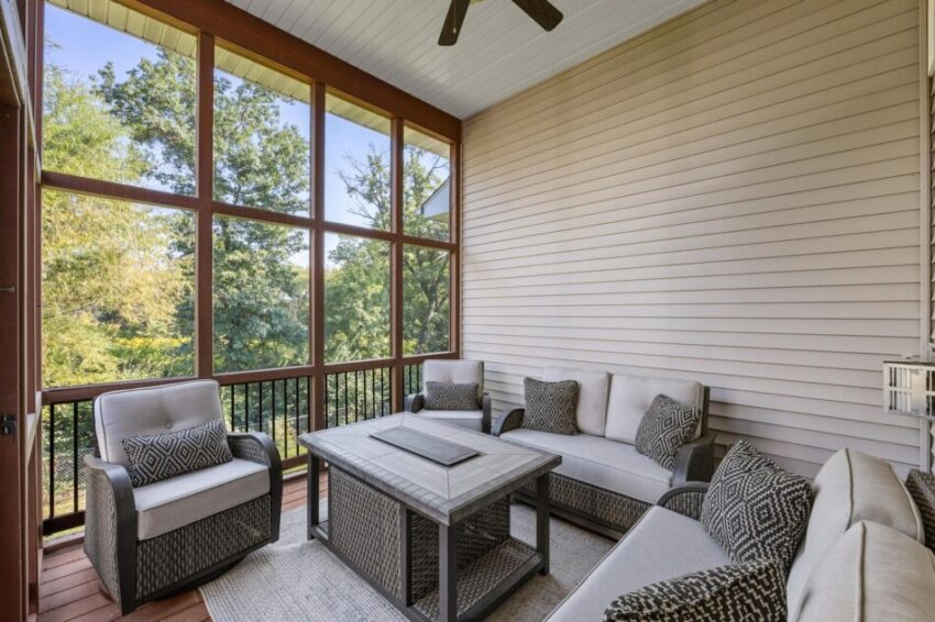 Screened porch with ceiling fan and beautiful view.
