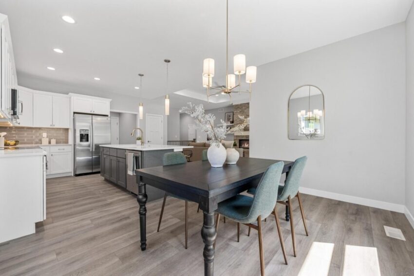 Dining room with view of kitchen beyond.