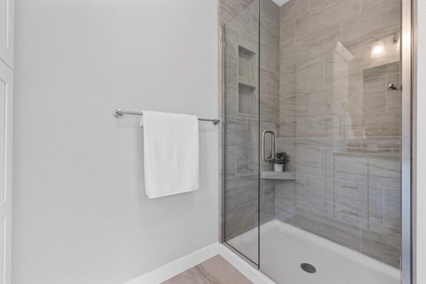 Bathroom 1, with built in tiled shower with glass door.