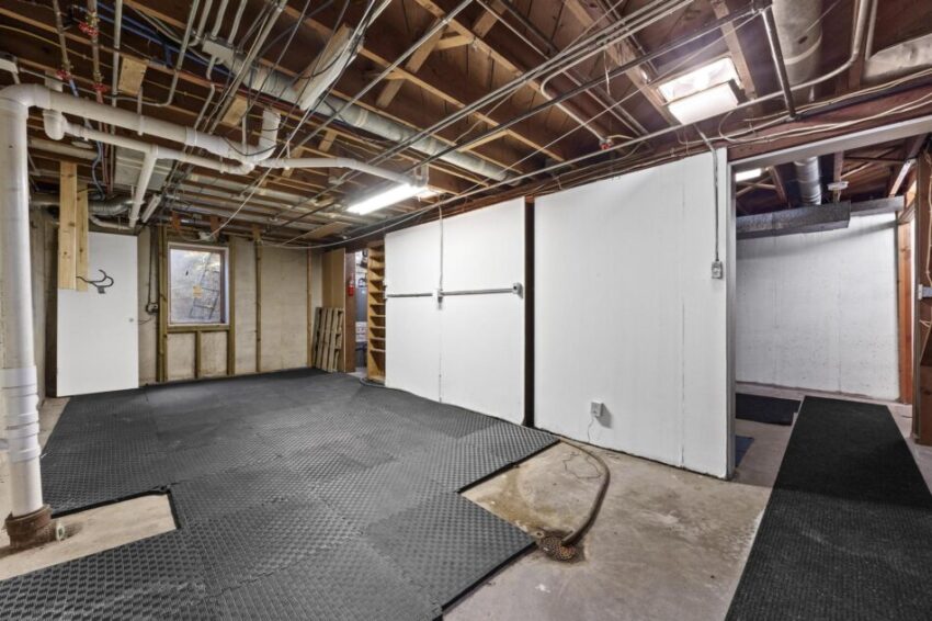Unfinished basement with storage space.