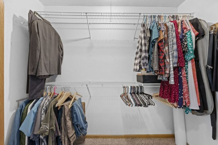 Spacious closet is wire shelving system.