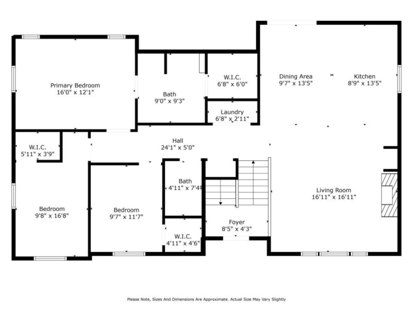 Floor plan with three bedrooms, two bathrooms, kitchen, living room, and laundry area.
