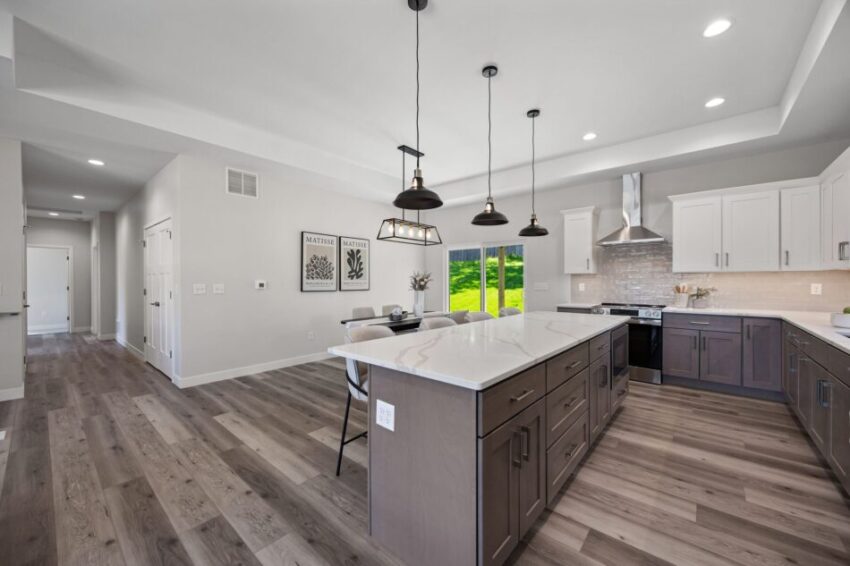 Modern open-concept living room and kitchen with eat-in island.